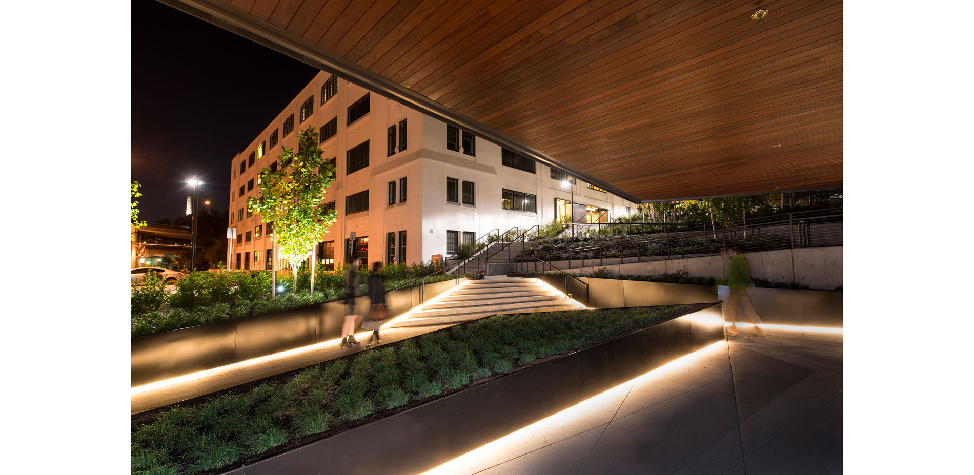 The new entry plaza creates an active open space for the main lobby and adjacent retail spaces. The existing pedestrian ramp and staircase on the nort…