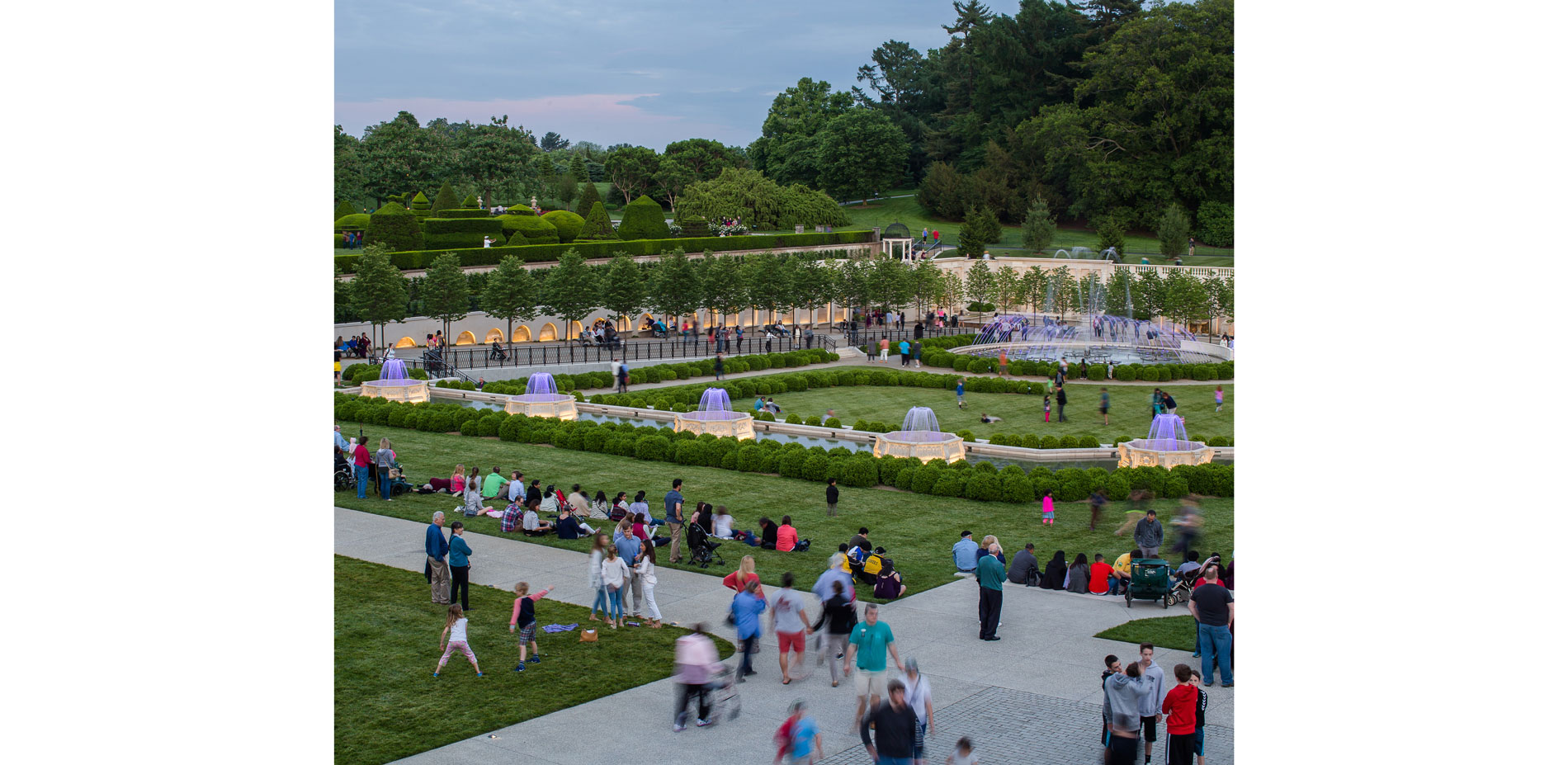 Before the fountain show in the evening, people gather on the lawn to get a good view.…