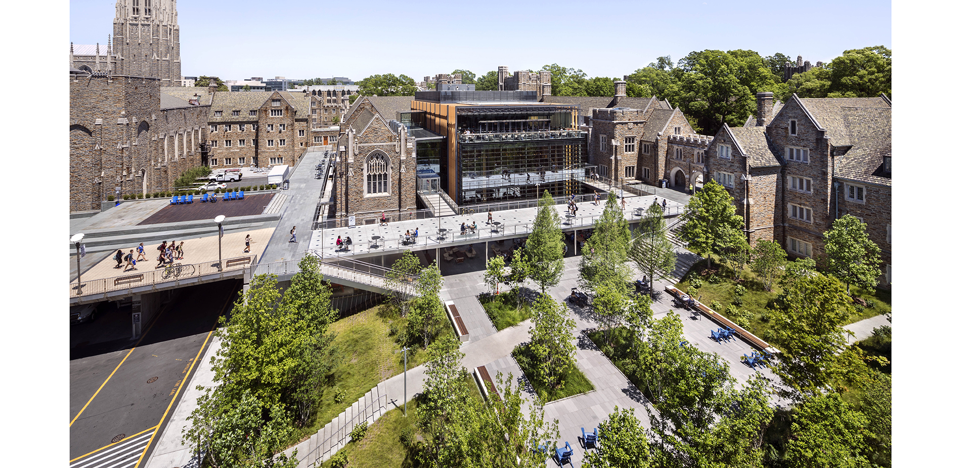 Today, terraces connect buildings and step down from the quad to the surrounding woodland. An organized, five-bay loading dock is contained beneath th…