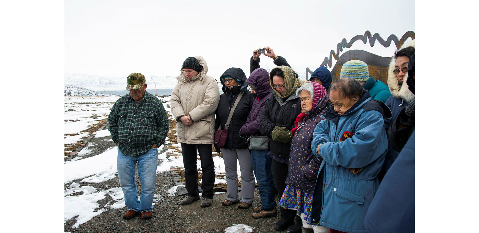 A ceremony is held within the cemetery…