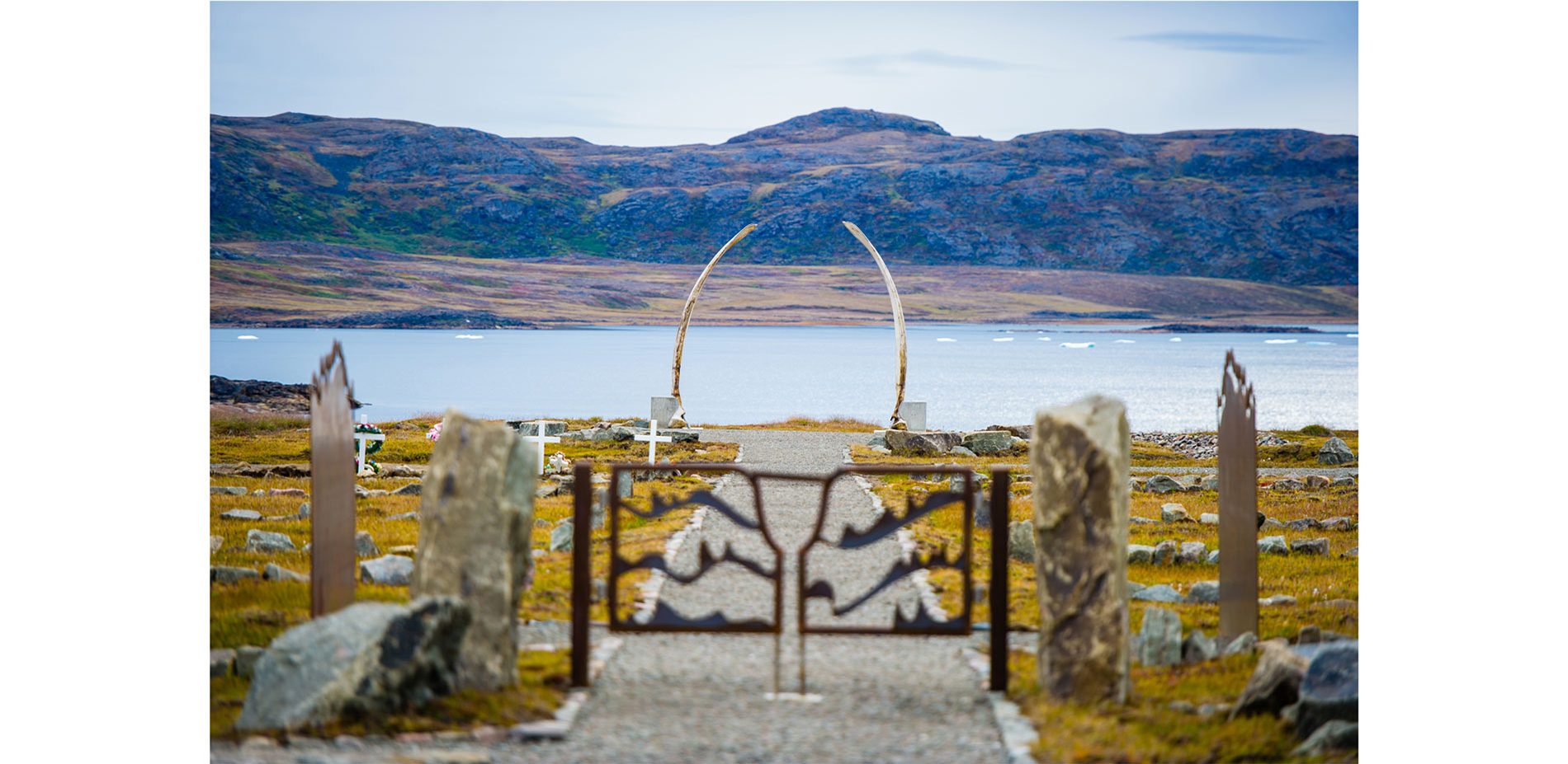 The whale bone arch anchors and frames the view towards the ocean, symbolizing the afterlife …