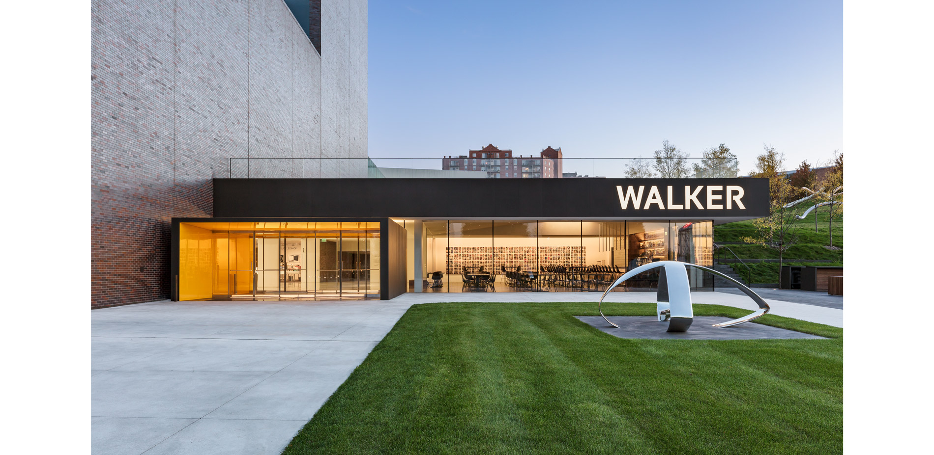 The Walker previously lacked an engaging public space which unified the distinctive architecture and landscape. A dining patio accented by the Honeylo…