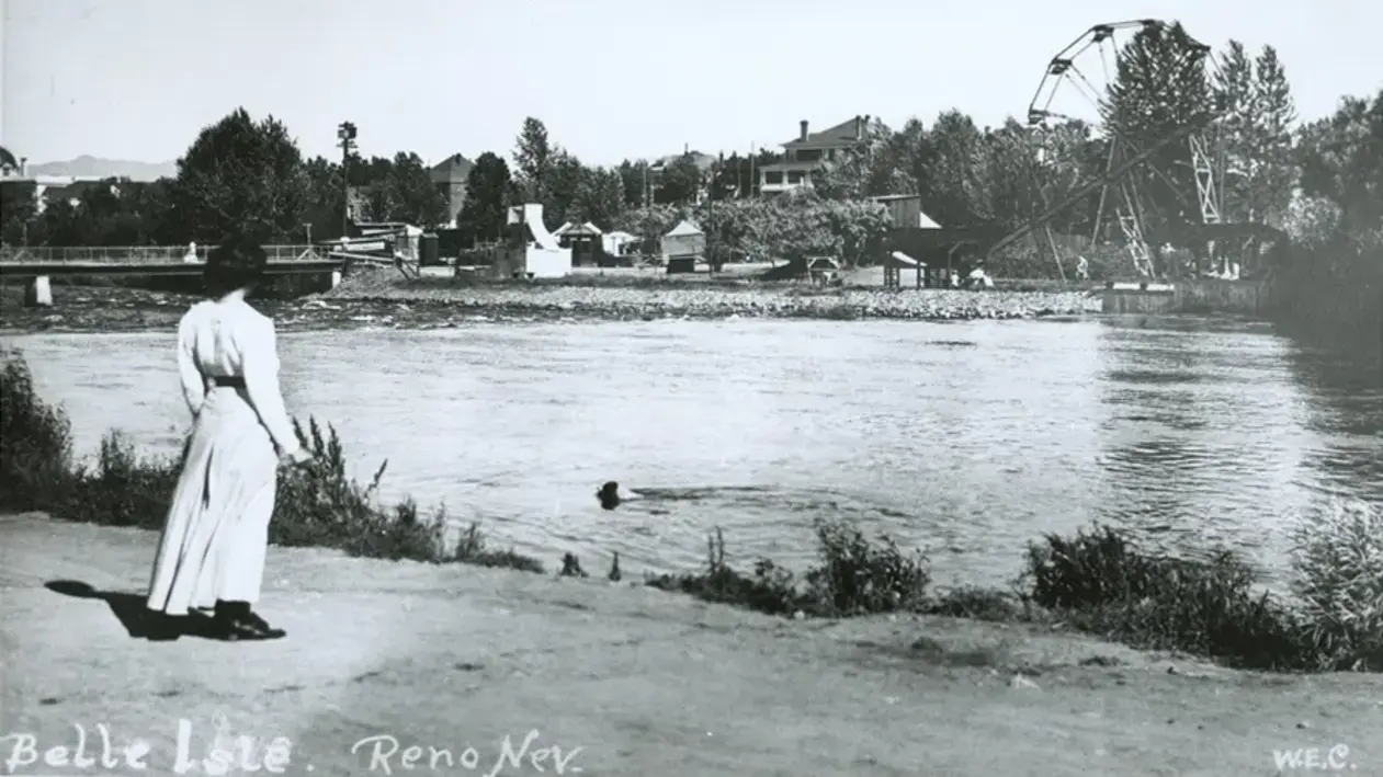 Woman standing on the shore of a lake