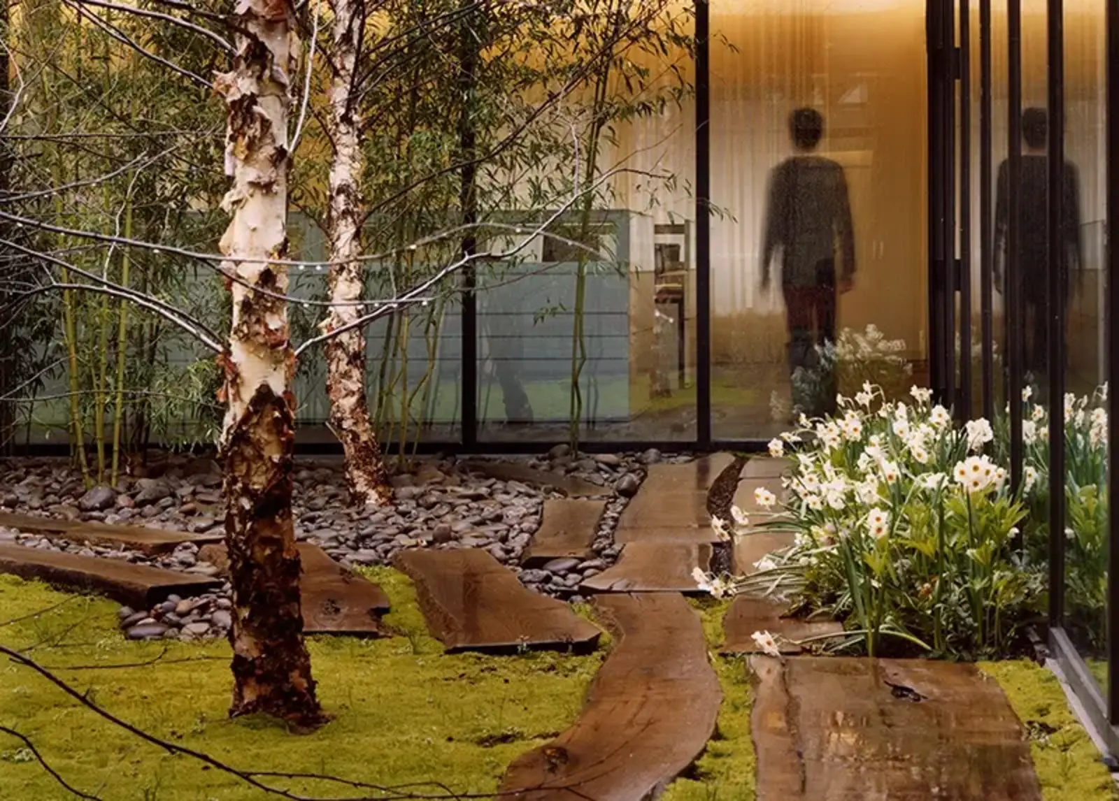 Black locust planks make up a walkway in an atrium garden. ASLA 2006 Professional General Design Honor Award. 