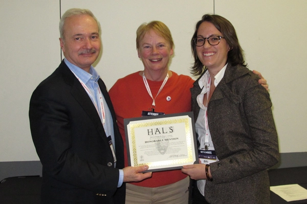 Honorable Mention winners Helen Erickson and Brianna Lehman accepting the award from Paul Dolinsky, Chief of HALS. image: Chris Stevens