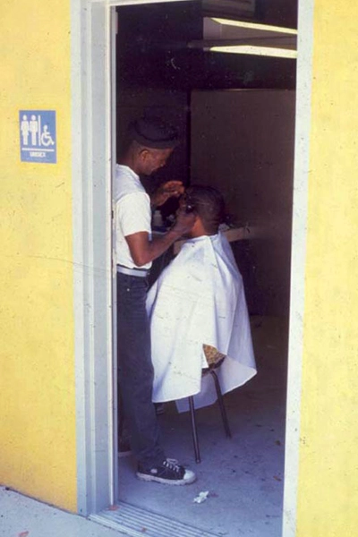 Lafayette Square Park is inclusive by design - accommodating users as diverse as wealthy Asian parents with small children, old African American men, multi-ethnic teens and the informal economy of hair cutting. image: Hood Design