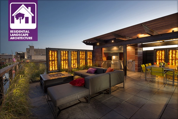 Keeping it simple. This outdoor kitchen tucked into a corner of a rooftop outdoor living area in Fargo, ND features only the appliances needed to serve the outdoor dining and living rooms. Image: Kalamazoo Outdoor Gourmet