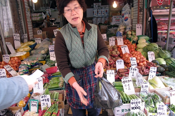 A local business owner struggles to survive in competition with supermarket chains with prices that are below her own costs. image: DURI 