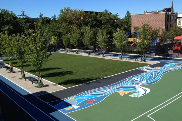 Renovations at Brooklyn’s P.S. 261 added an artificial turf field, rain gardens to absorb runoff, a gazebo with green roof, rain barrels for irrigation water, and permeable paving. All told, the half-acre park can capture about 500,000 gallons of stormwater annually. image: Pedro Diez