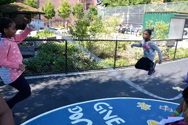 PS 261: children playing with the new rain garden and gazebo in the background. image: Pedro Diez