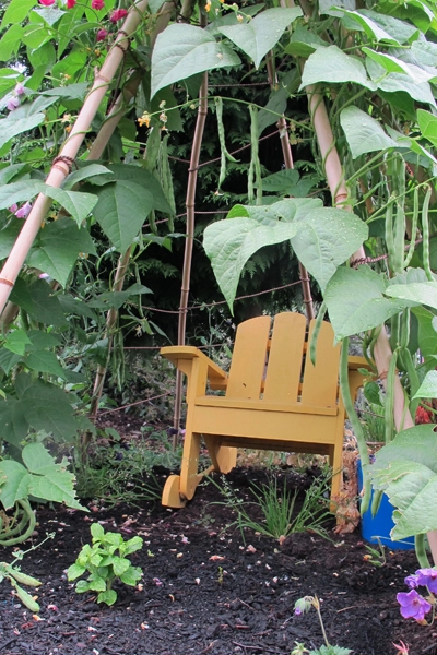 A bean tipi furnished with a rocking chair with arms is an ideal nook space for children who need to regroup. image: Amy Wagenfeld