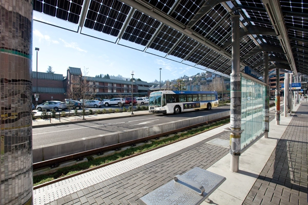 TriMet's Portland-Milwaukie Light Rail Transit Project (PMLR). Note the photovoltaic cells on shelter roofs. image: ©2015 Tim Jewett / Trimet
