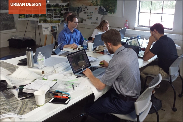 Interdisciplinary team members at work in a charrette studio