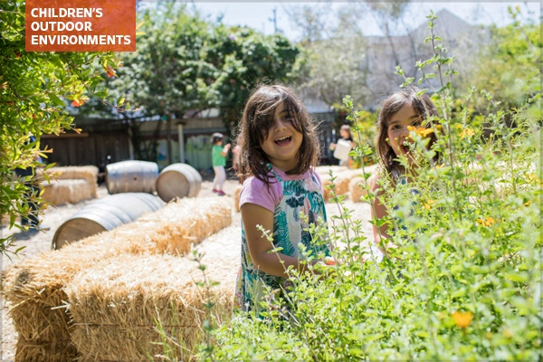 Children playing, green schoolyard, Golestan School