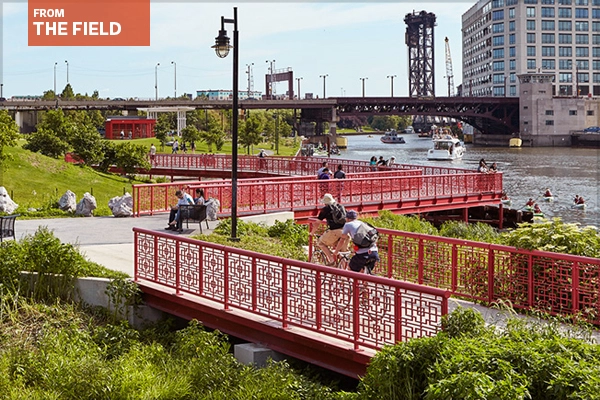 Cyclists and park visitors on a bridge in Ping Tom Memorial Park