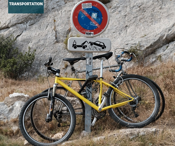 Bicycles locked to road sign