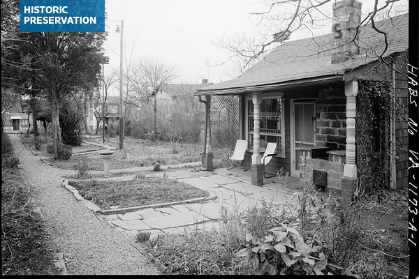 Black and white photograph with perspective view of house