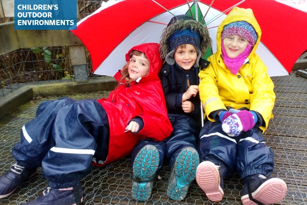 Children playing in the rain
