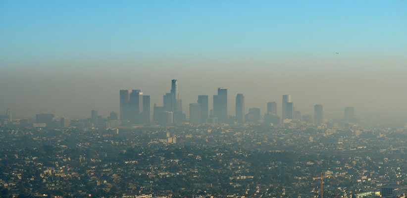 Distant shot of a cloud of smog over a city