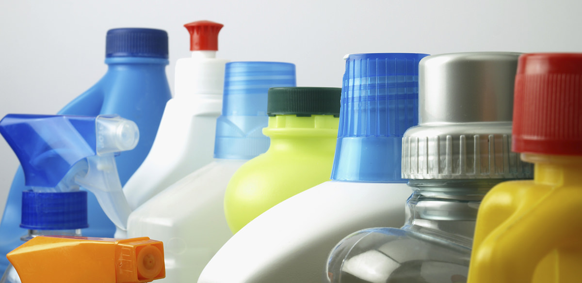 A bucket of assorted unmarked cleaning projects isolated on a white background